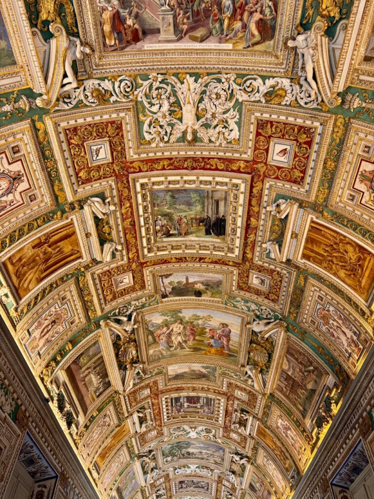 Stunning view of the ornate ceiling in Vatican City, showcasing artistry and history.